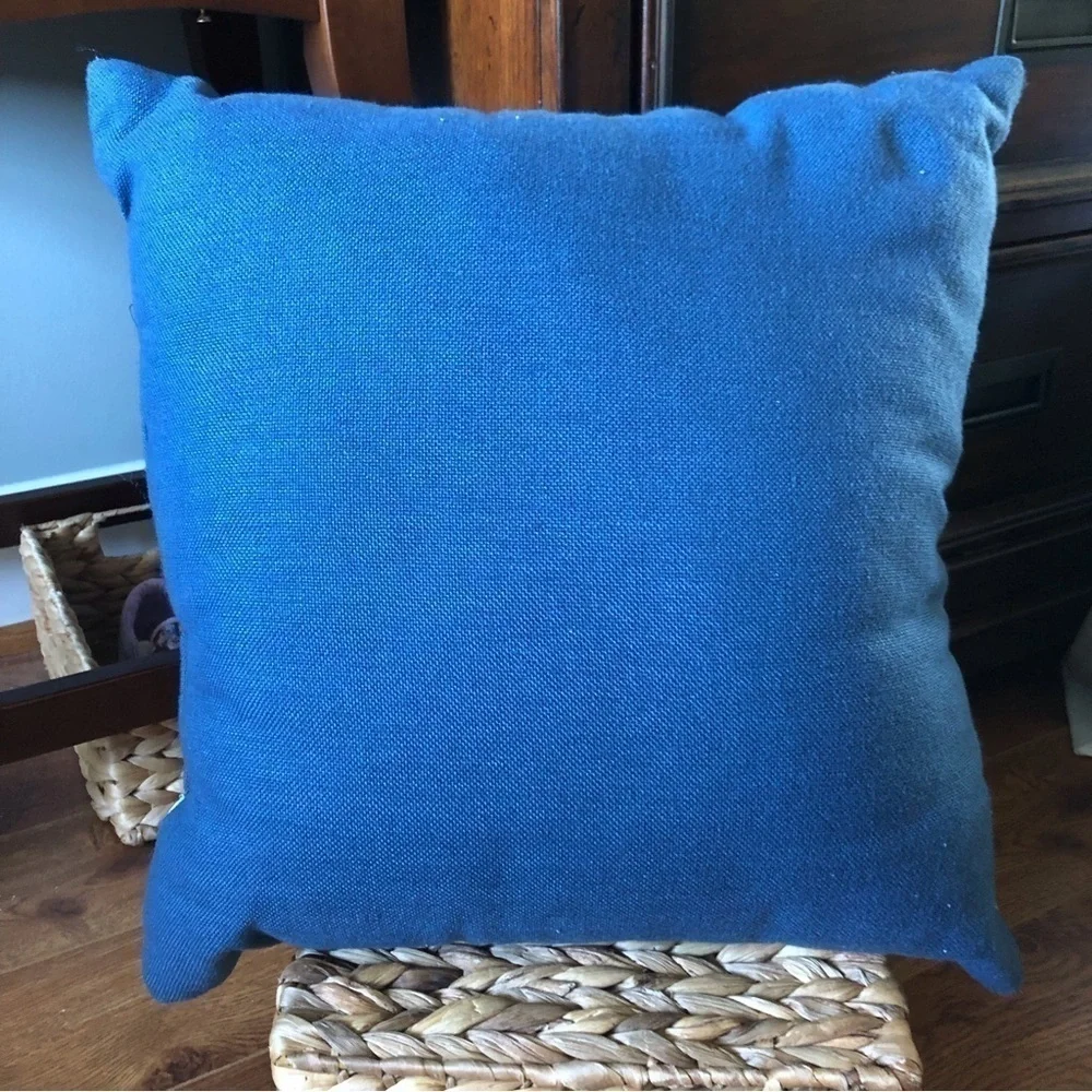Navy and white embroidered square pillow